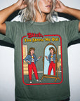 A woman wearing a green t-shirt with a graphic design depicting a woman looking into a mirror and the text "Bitch, You Stress Me Out" above the image.