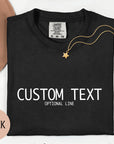 a black t-shirt with white text, a gold star pendant, and a brown hat, along with some flowers and a pink circle.