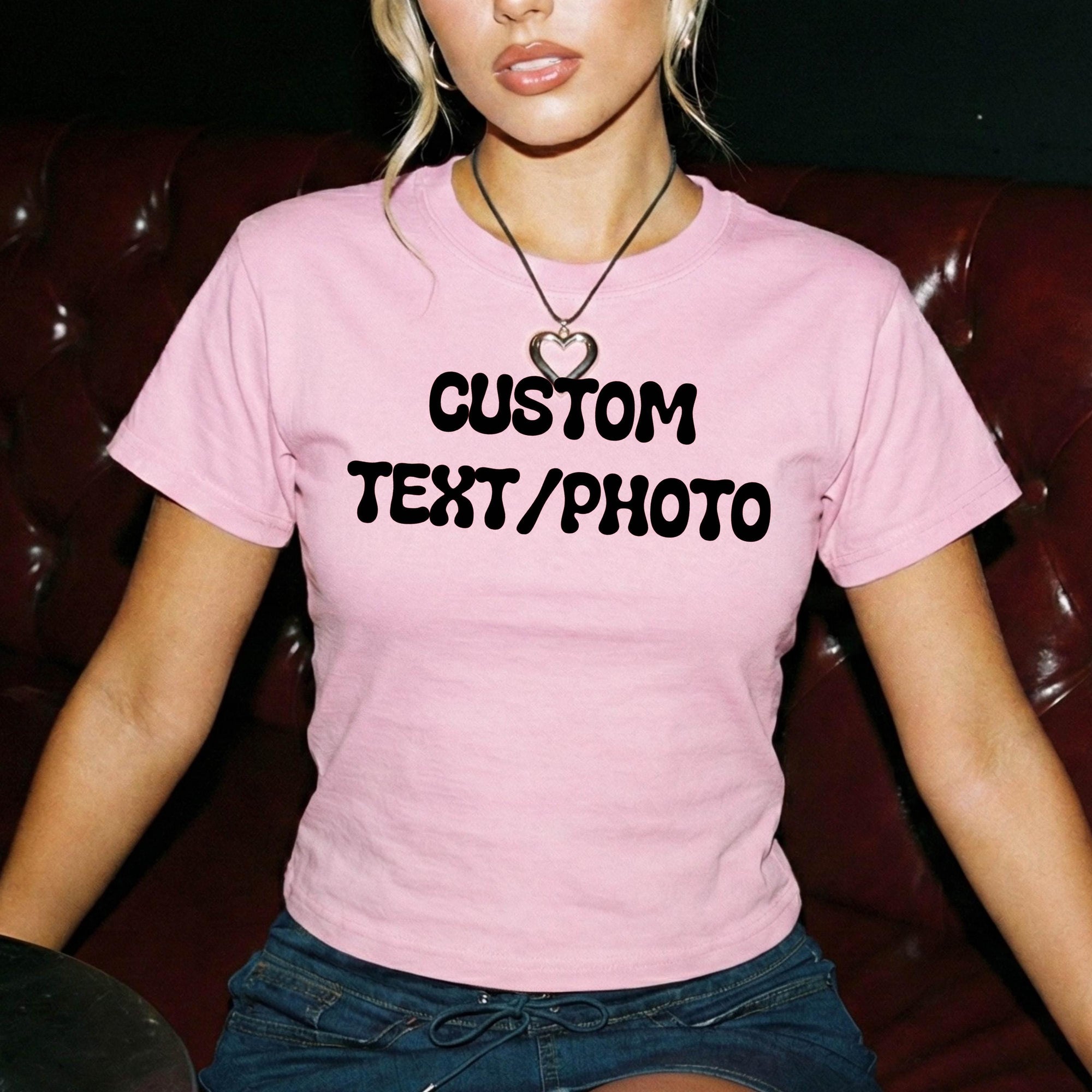 A woman wearing a pink t-shirt with the text &amp;quot;CUSTOM TEXT/PHOTO&amp;quot; printed on it.
